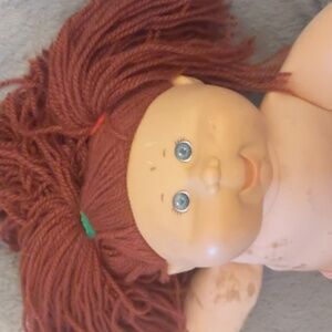 Red headed Cabbage Patch doll.